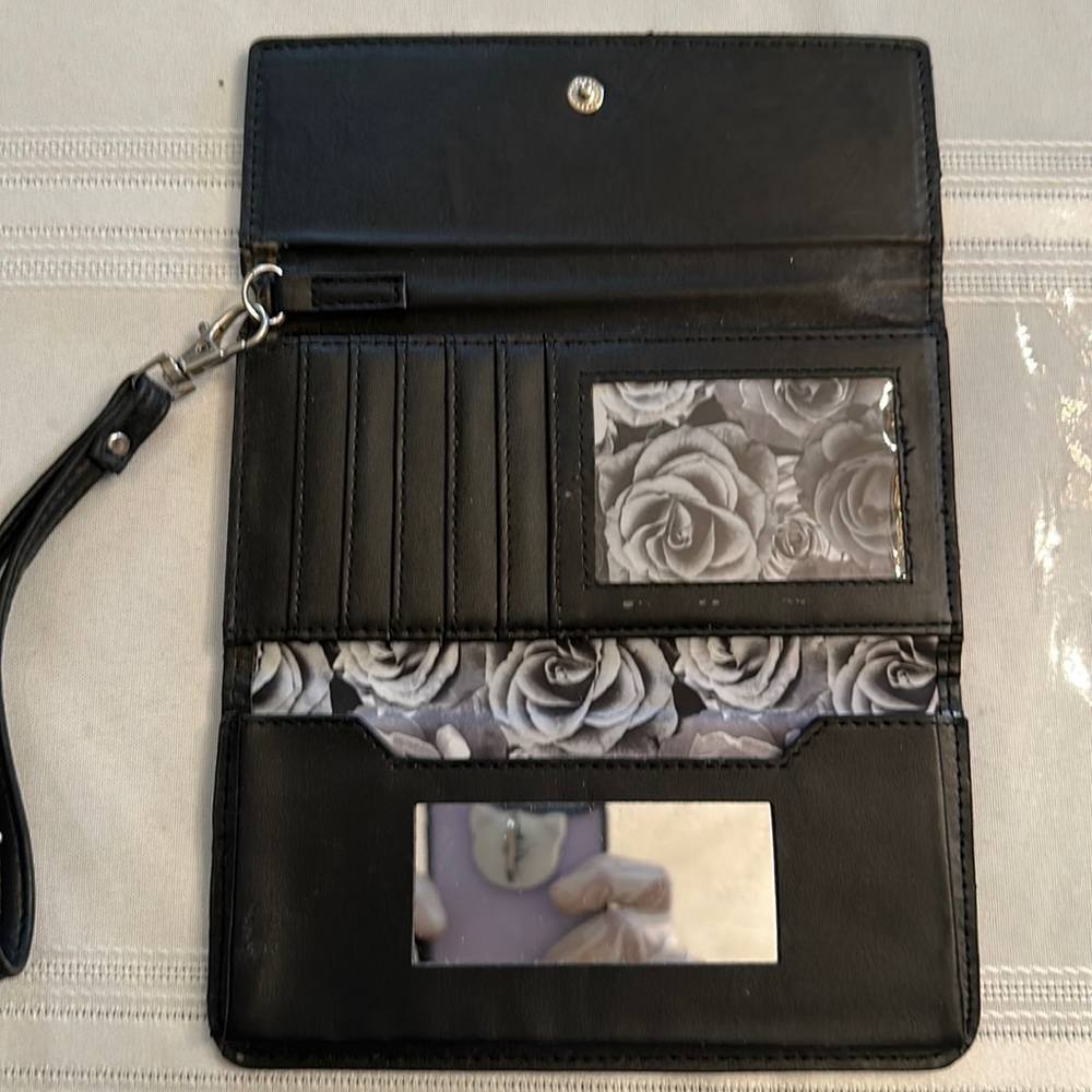 Used Adrienne Vittadini Studio black wristlet card holder wallet.